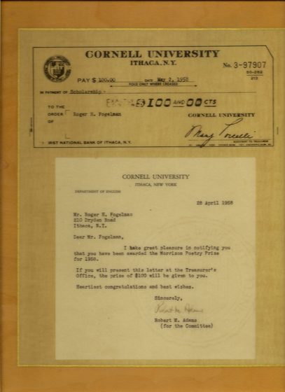 A framed display holding two documents: a Cornell University check for $100 made out to Roger H. Fogelman, dated May 2, 1958, and a letter from the Cornell Department of English dated 28 April 1958 notifying him that he has been awarded the Morrison Poetry Prize for 1958, signed by Robert M. Adams for the committee.